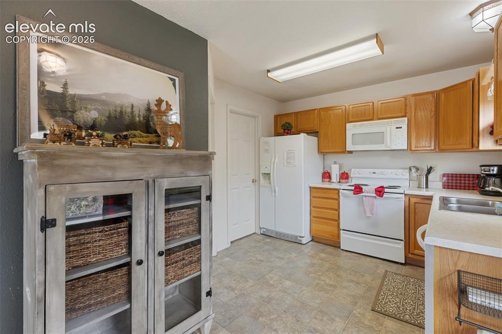 Image 15 of 36: Roomy kitchen with plenty of cabinet space.