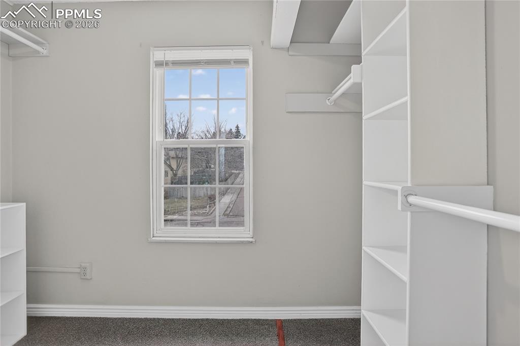 Image 10 of 20: Large primary walk-in closet