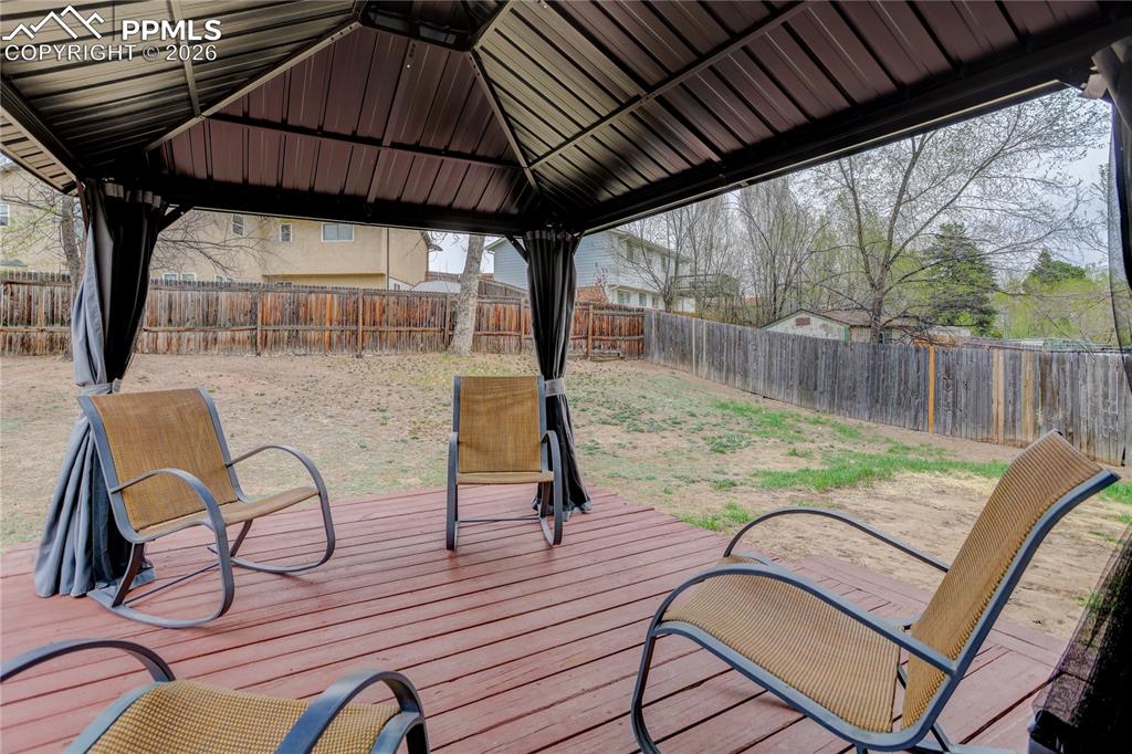 Image 18 of 20: Wood deck w/ pergola