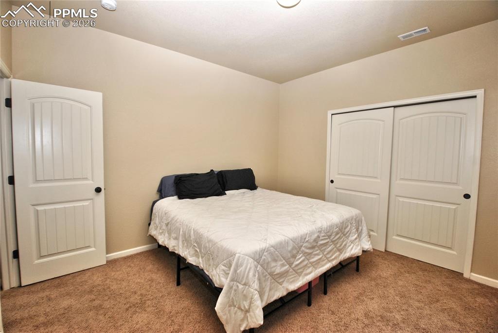 Image 29 of 38: Bedroom