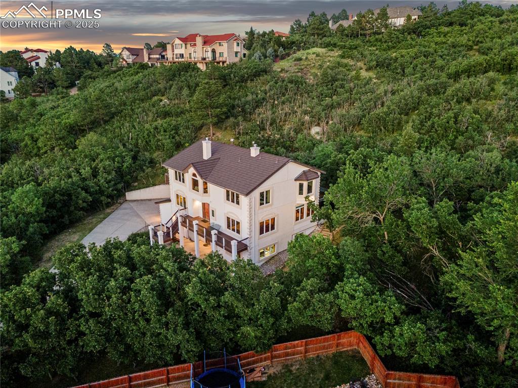 Image 7 of 49: Aerial view of a tree filled landscape