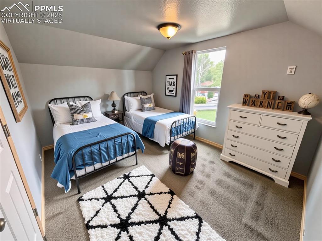 Image 23 of 35: Virtually staged Bedroom featuring vaulted ceiling, light colored carpet, a