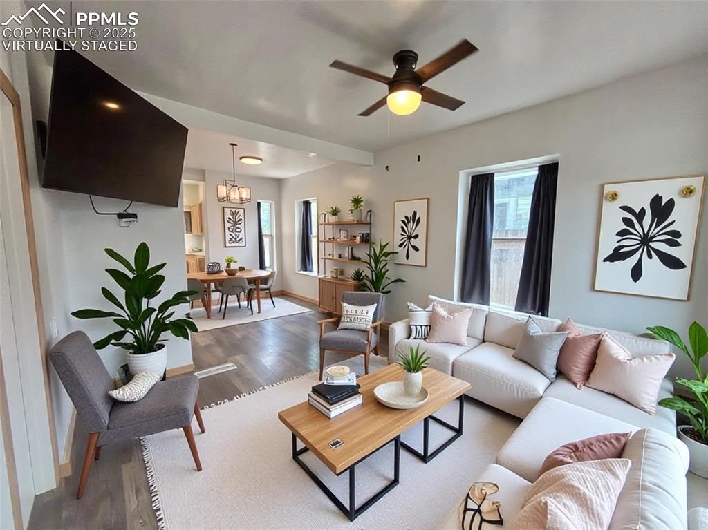 Image 5 of 35: Virtually staged Living room featuring wood finished floors, ceiling fan, a