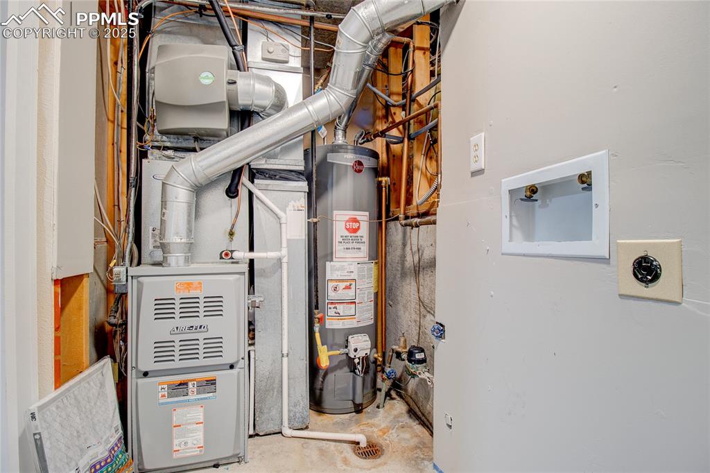 Image 26 of 32: Utilities with water heater