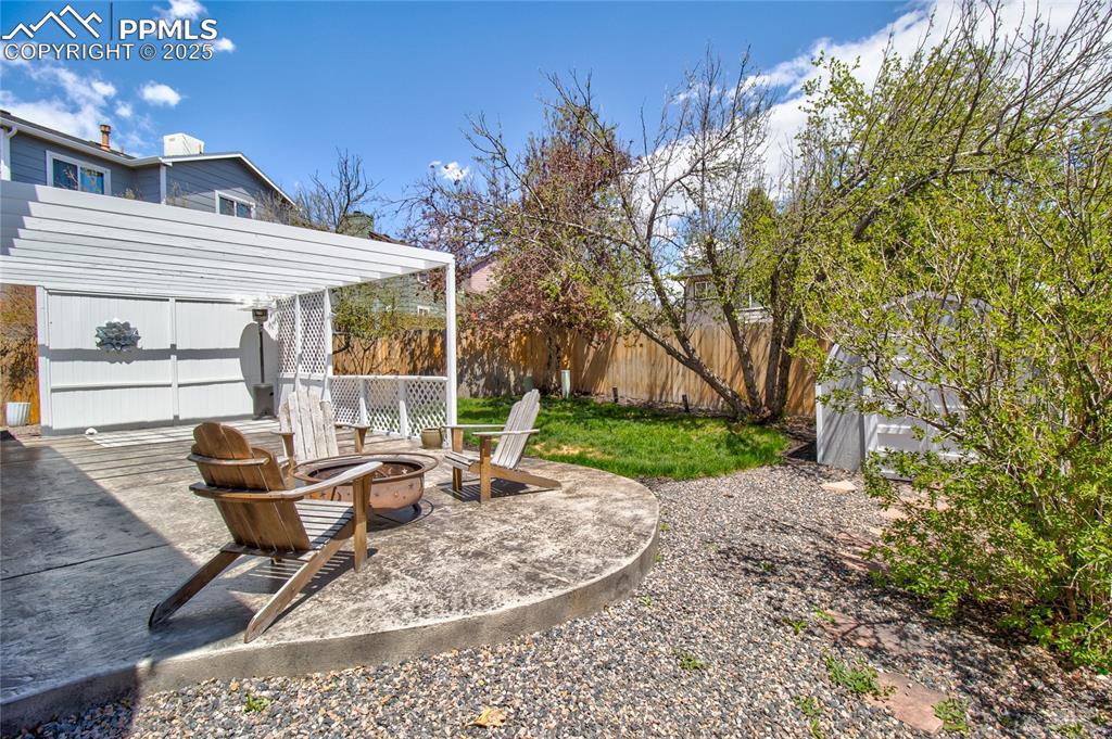 Image 31 of 32: View of yard with a fire pit