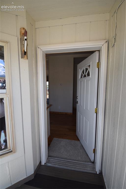 Image 7 of 48: White paneled exterior siding with contrasting trim