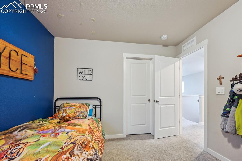 Image 15 of 46: Walk-in closet