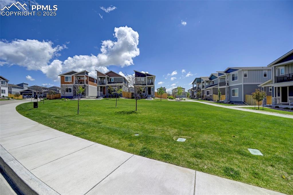 Image 40 of 46: Surrounding community with a residential view and a yard