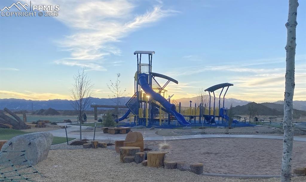 Image 42 of 46: Community playground with a mountain view