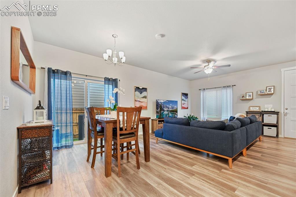 Image 6 of 46: Dining space, Open Flo, Sliding door leading to the side yard.