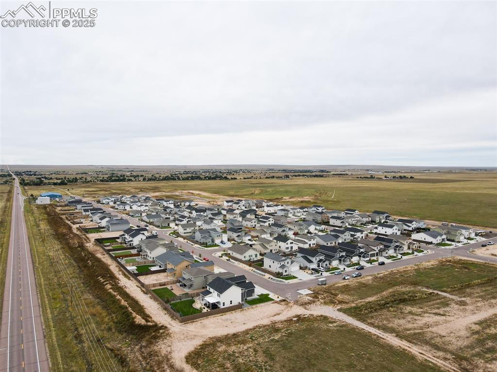 Image 15 of 50: View of property location with nearby suburban area