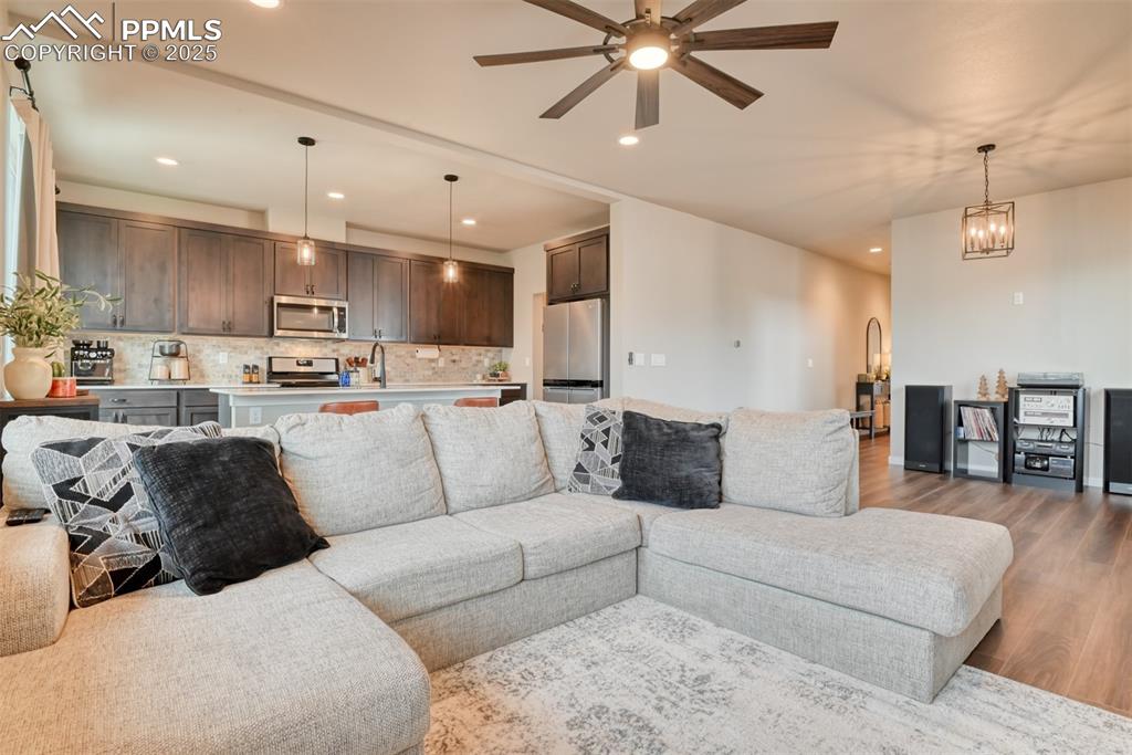 Image 43 of 50: Living area featuring recessed lighting, wood finished floors, and a ceilin