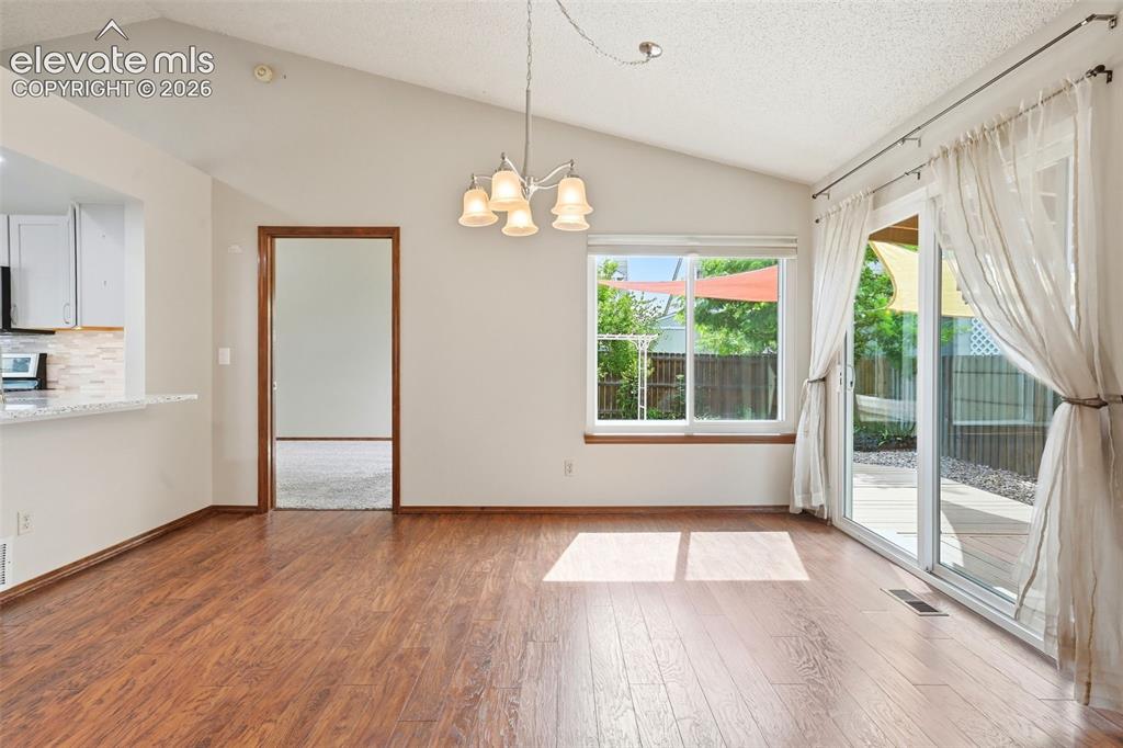 Image 10 of 49: Dining area with walk out to rear yard