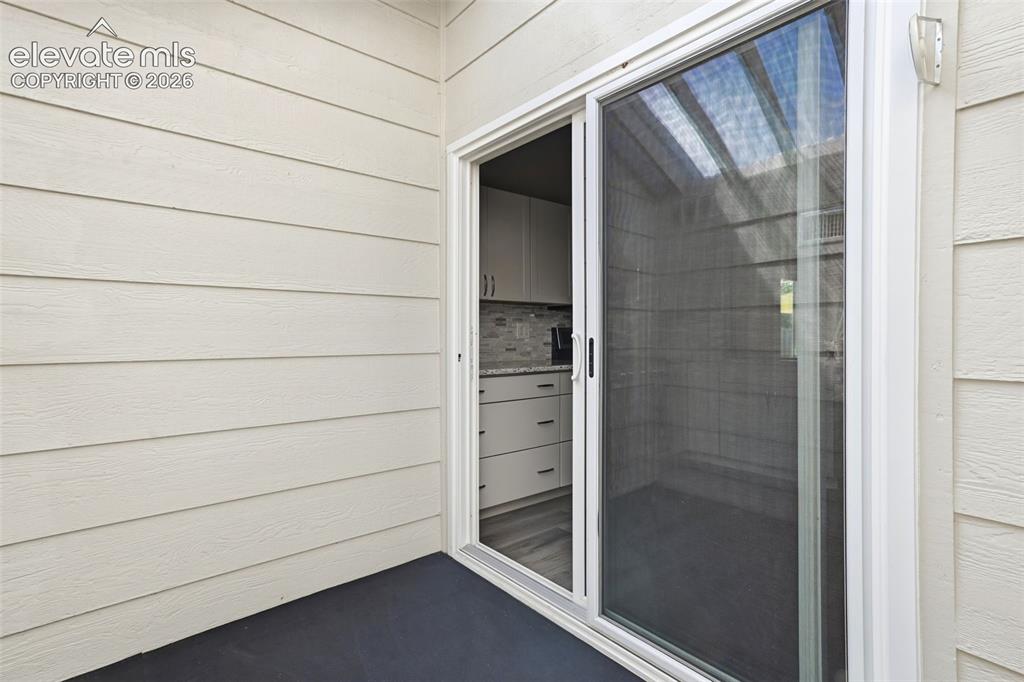 Image 16 of 49: Walk out to sun room