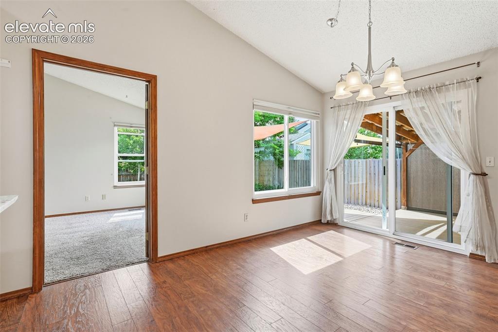 Image 19 of 49: 11x15 dining area with walk out to rear yard