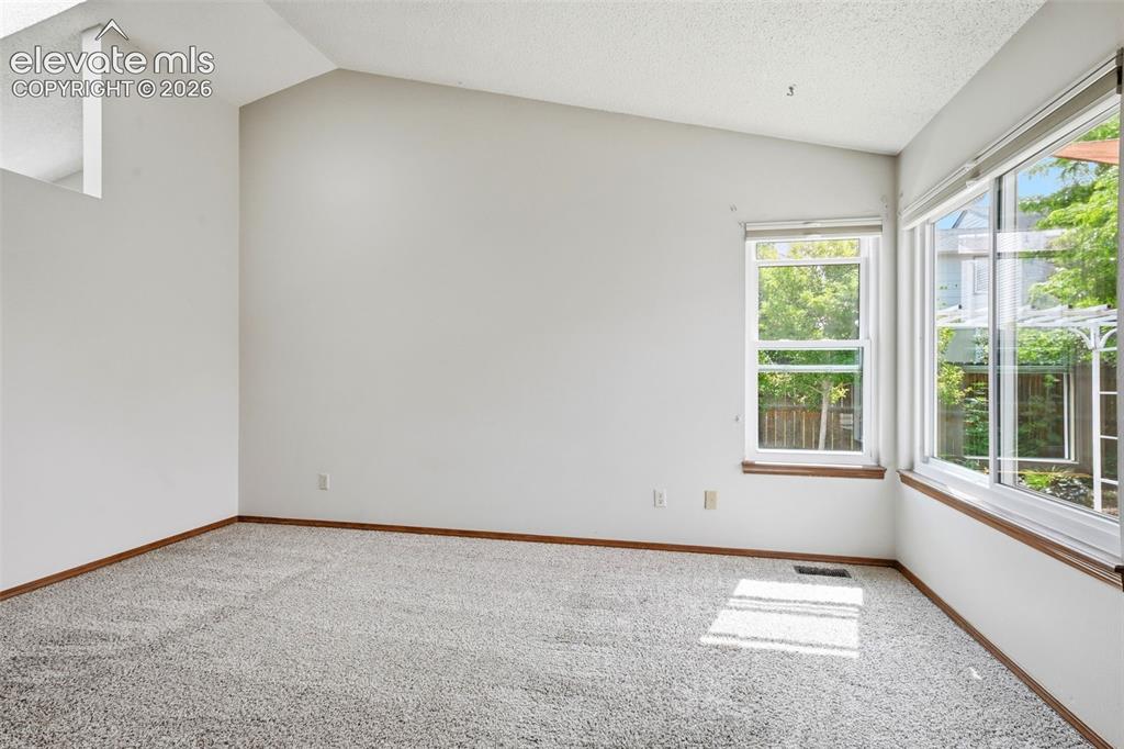 Image 25 of 49: Vaulted ceilings and windows make it light & bright