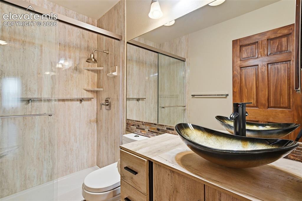 Image 33 of 49: Completely remodeled 3/4 guest bath