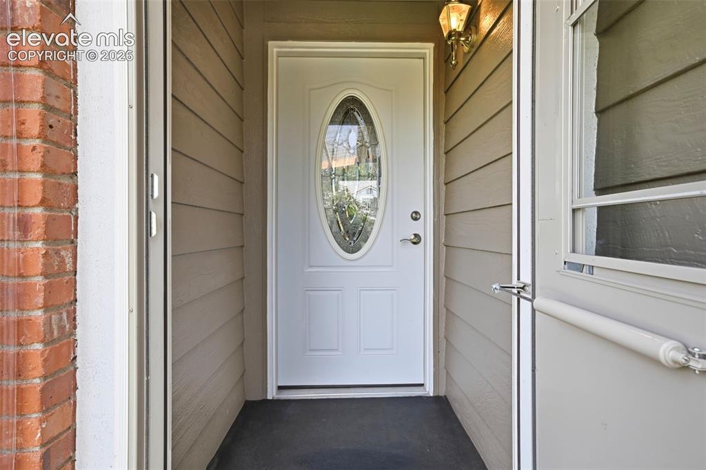 Image 6 of 49: Climate protected storm door entry