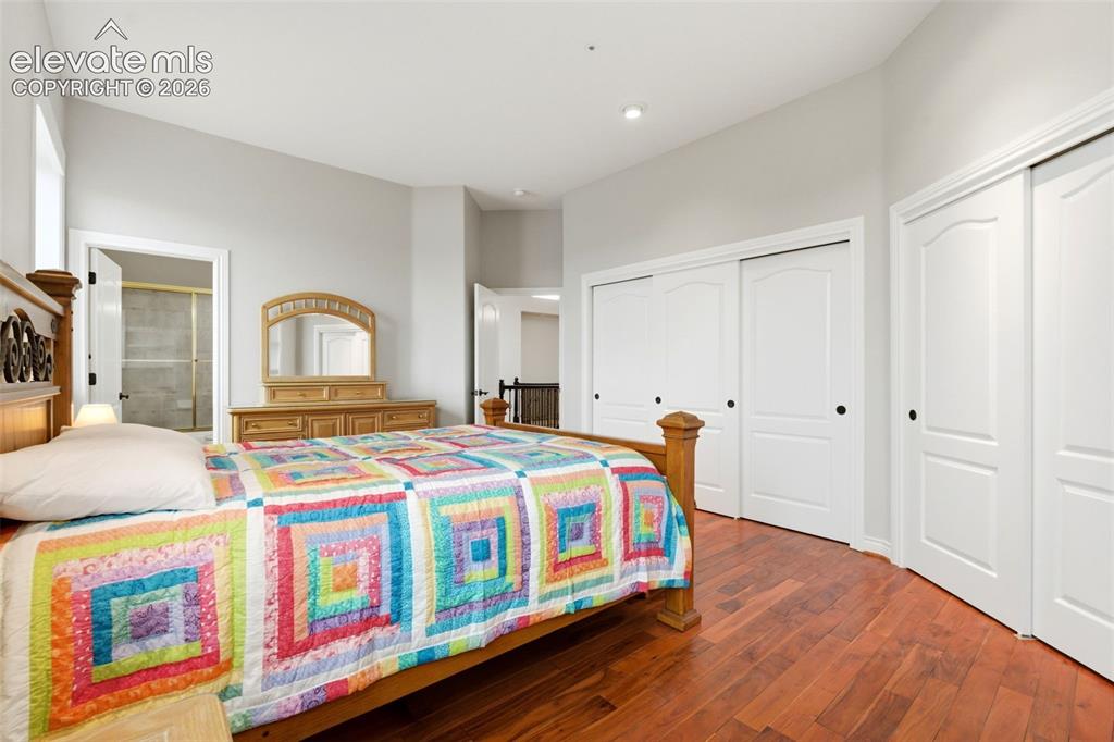 Image 29 of 46: Hardwood flooring, recessed lighting, vaulted ceiling, sliding closet doors