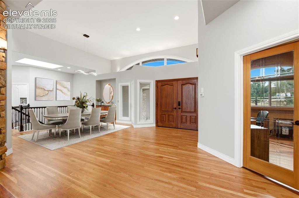 Image 7 of 46: Virtually staged. Hardwood flooring, double entry doors, vaulted ceilings,