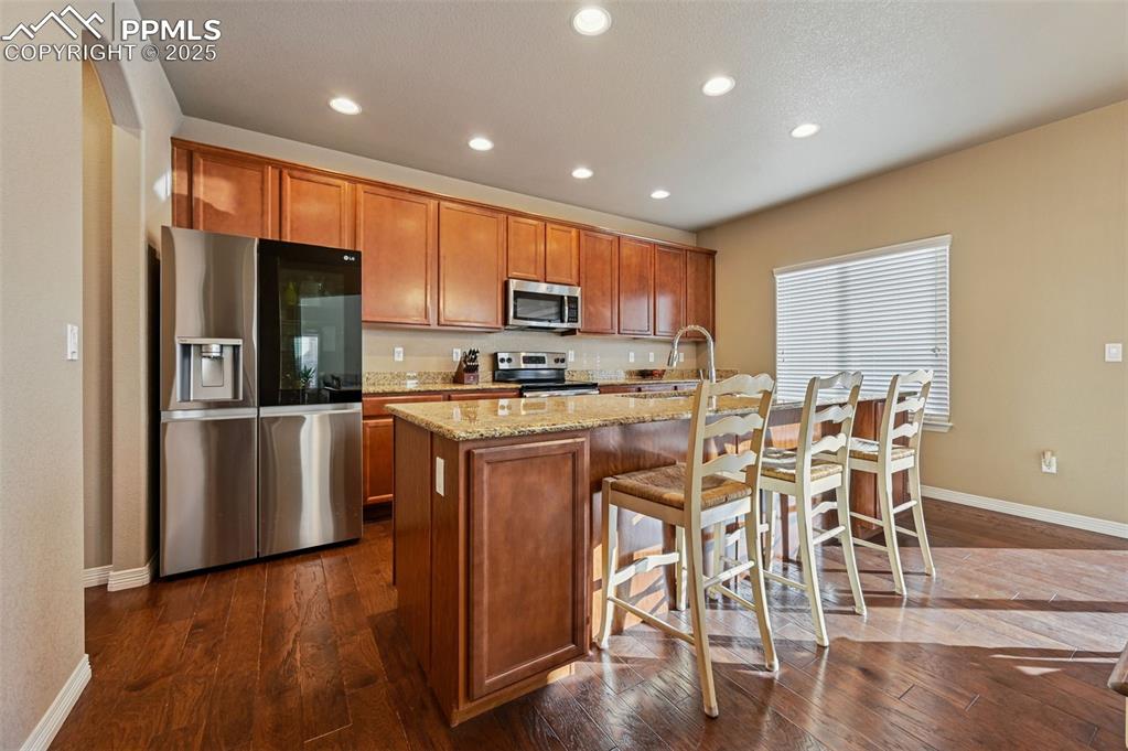 Image 7 of 25: Kitchen Island with Breakfast Bar