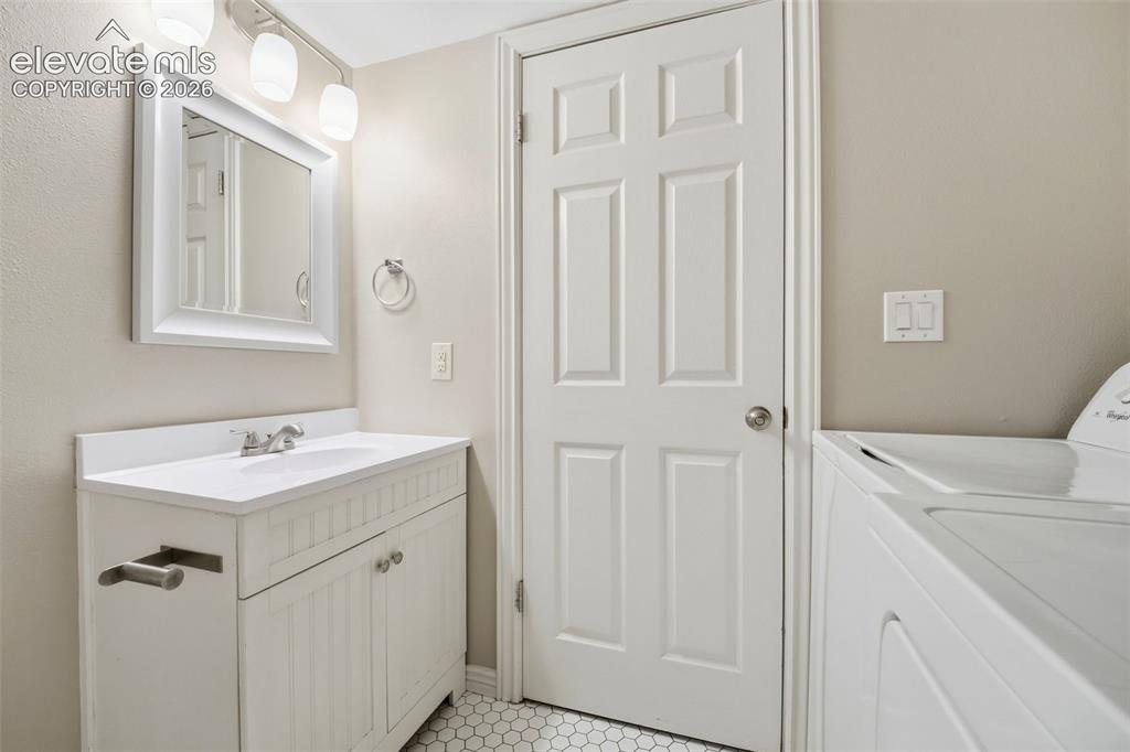 Image 16 of 44: Main level 1/2 bath