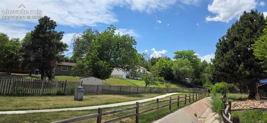 Image 33 of 44: Walking path along south end of complex