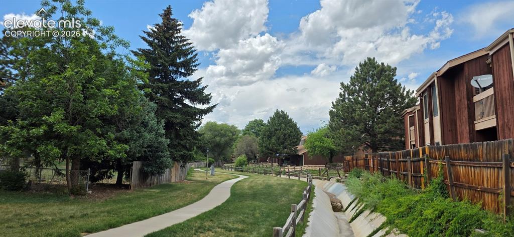 Image 34 of 44: Walking path along south end of complex