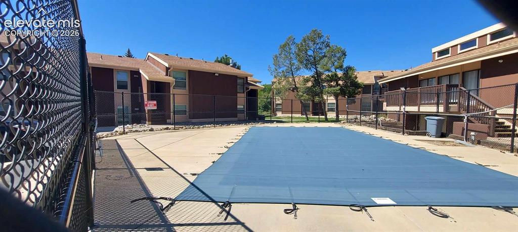 Image 35 of 44: Pool with clubhouse to the right
