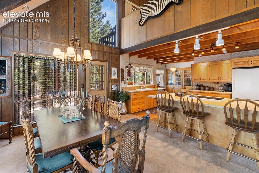 Image 14 of 33: Your dining area has easy access to the back patio