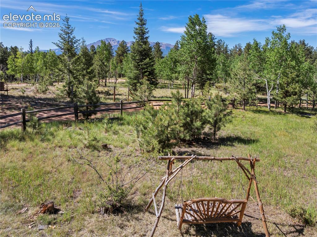Image 31 of 33: Come sit with me and feel the breeze surrounding Pikes Peak!