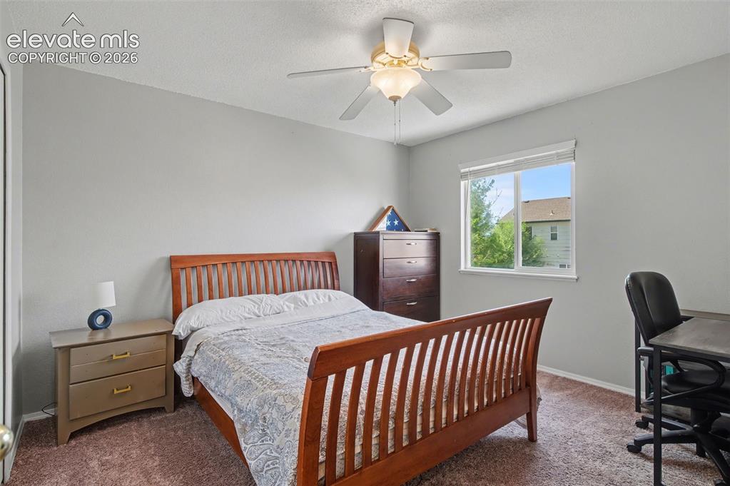 Image 28 of 37: Light gray painted walls with textured ceiling