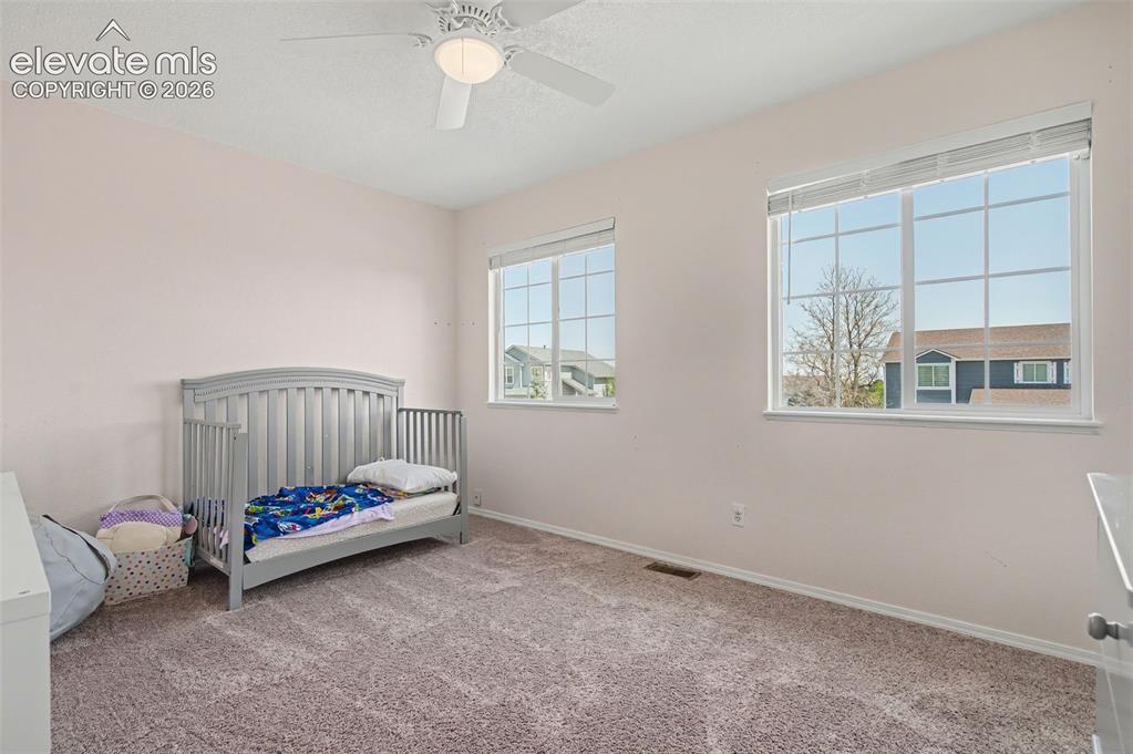 Image 30 of 37: Spacious interior with neutral wall tones and plush carpeting