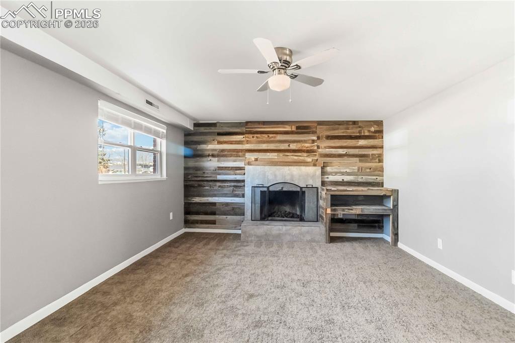 Image 17 of 42: Garden level basement living room, new carpet