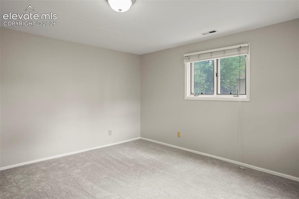 Image 15 of 29: Primary Bedroom- new carpet and paint!
