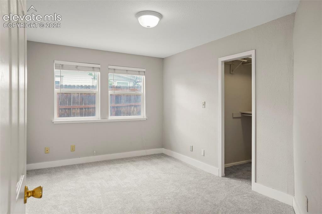 Image 16 of 29: Guest Bedroom- new carpet and paint!