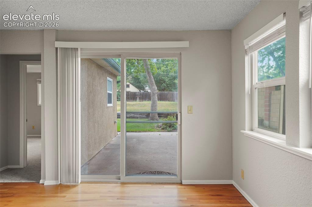 Image 19 of 29: View towards back patio and lush yard!