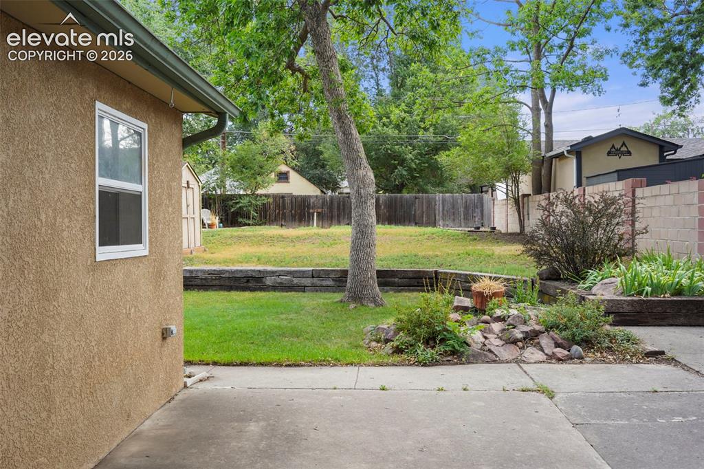 Image 20 of 29: Great patio space leads to your lush yard! 