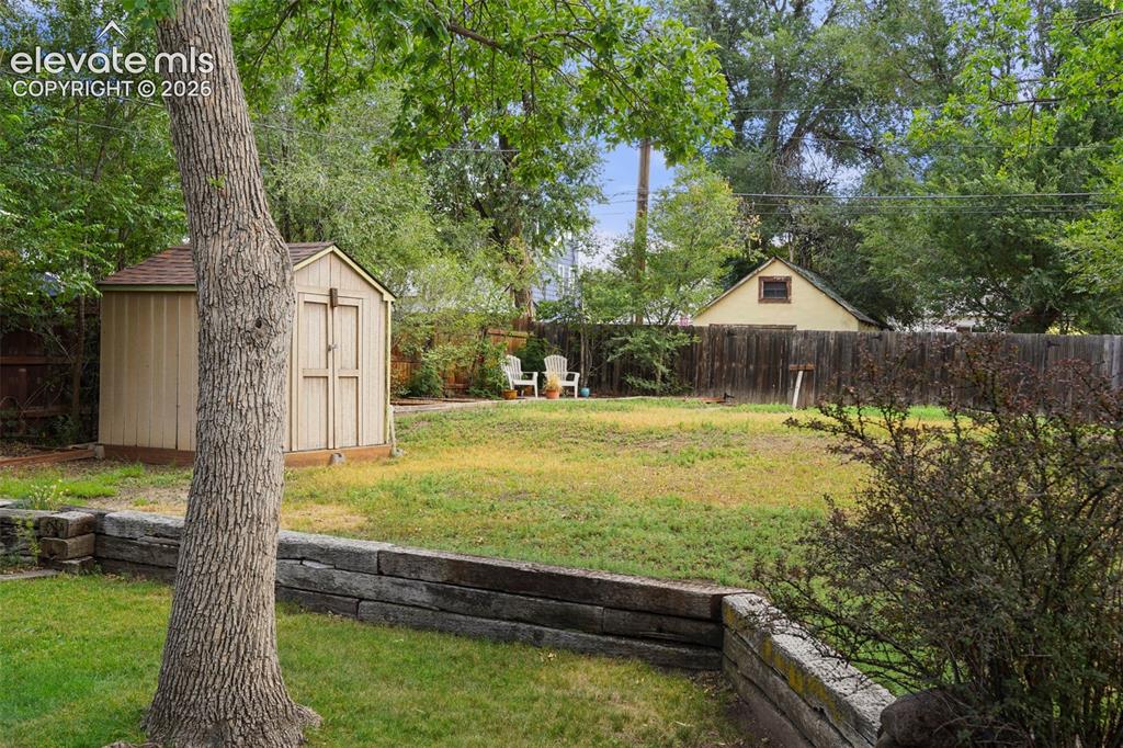 Image 23 of 29: Storage shed and lots of room for RV parking or building a garage!