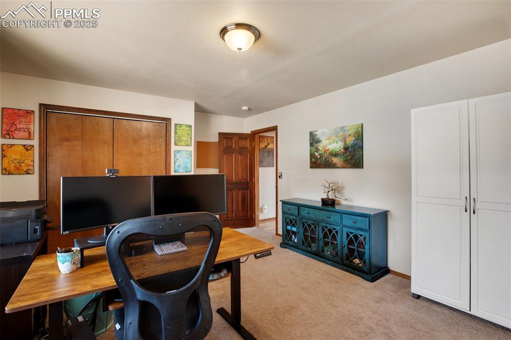 Image 35 of 50: Lower level bedroom, presently an office