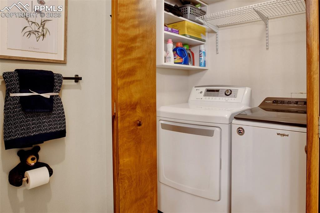 Image 38 of 50: Lower level laundry located in the full bathroom