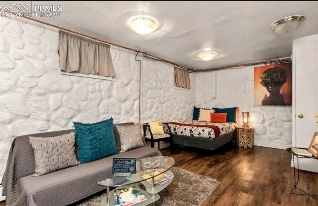 Image 15 of 16: Bedroom featuring wood finished floors