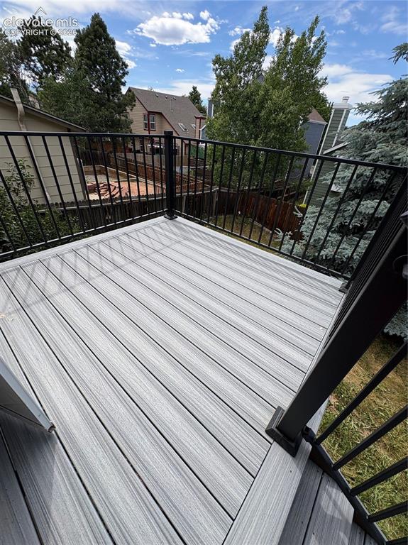 Image 17 of 23: New Composite Deck with metal railing
