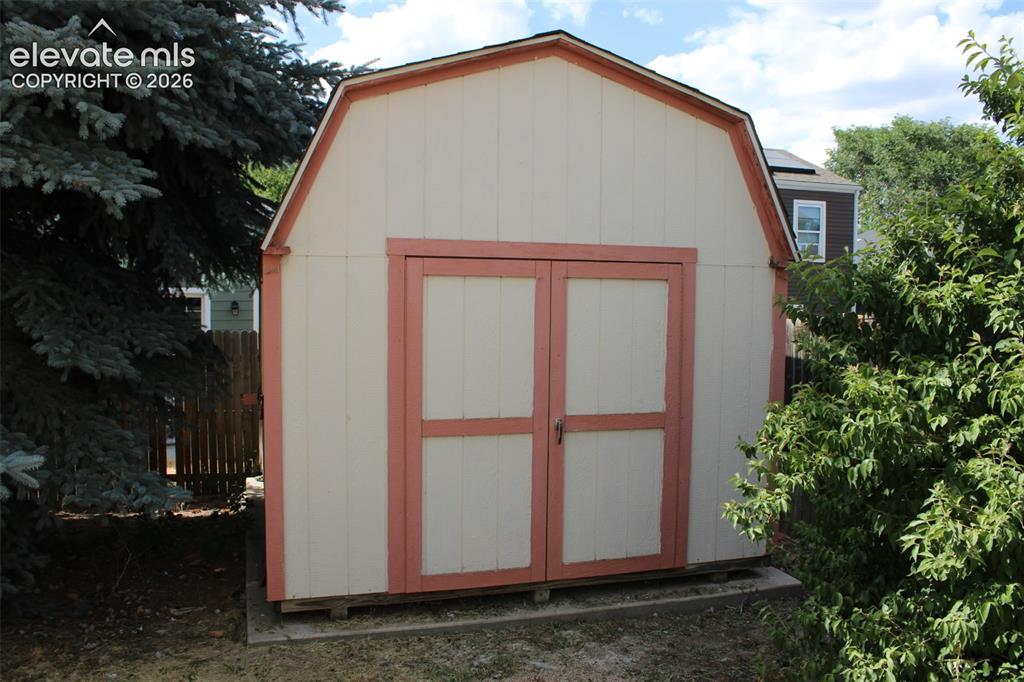Image 21 of 23: Nice sized storage shed for tools, mower, etc