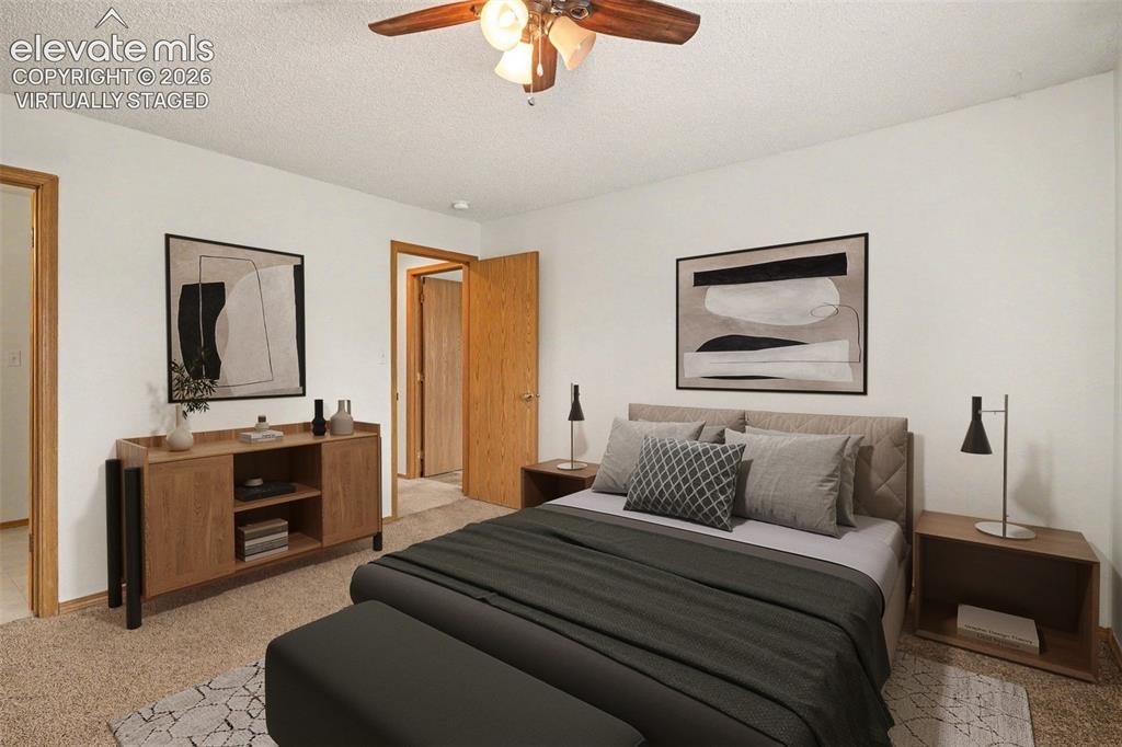 Image 13 of 30: Virtually staged bedroom with adjoining bathroom