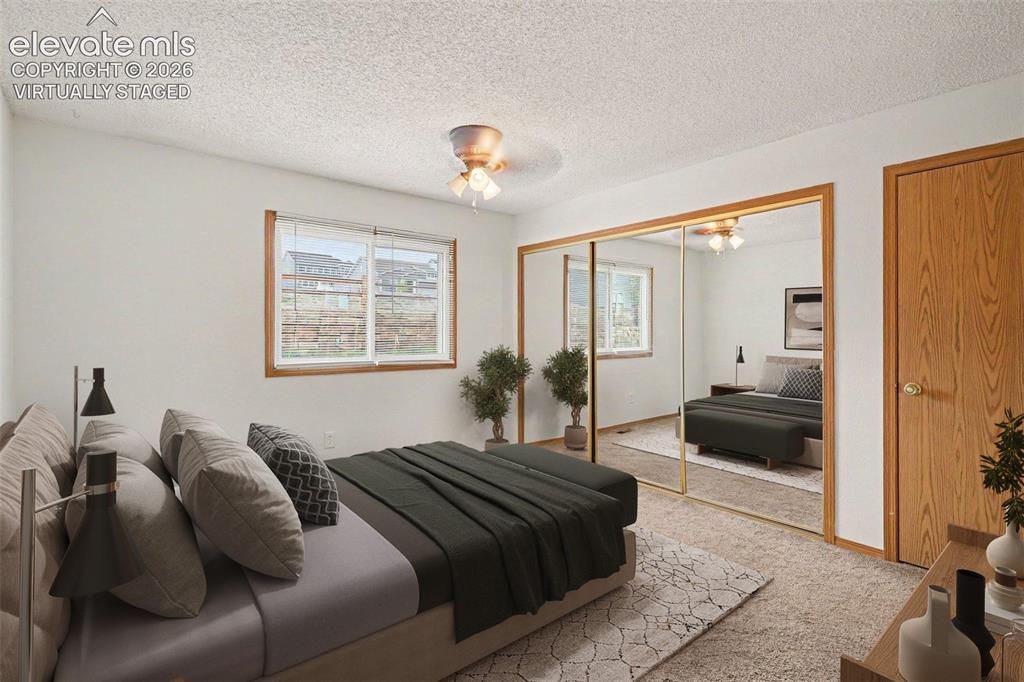 Image 14 of 30: Virtually staged bedroom with adjoining bathroom