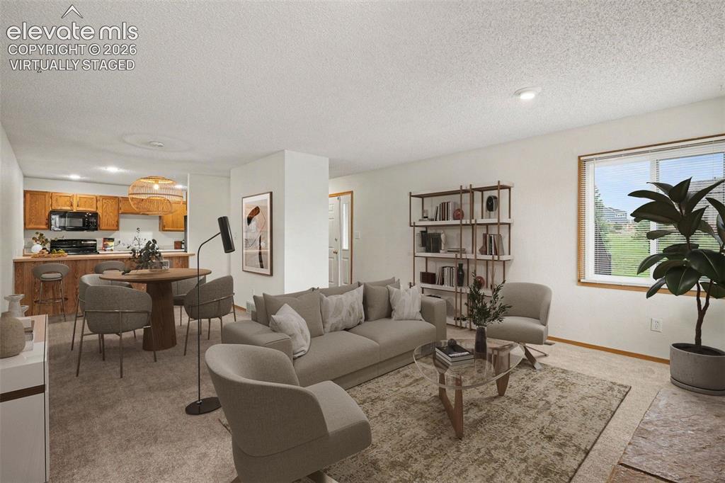 Image 5 of 30: Virtually staged living and dining area