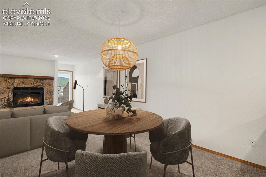 Image 6 of 30: Virtually staged dining area and living room