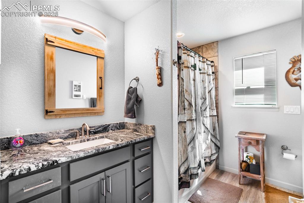 Image 12 of 50: Full bathroom with heated fan