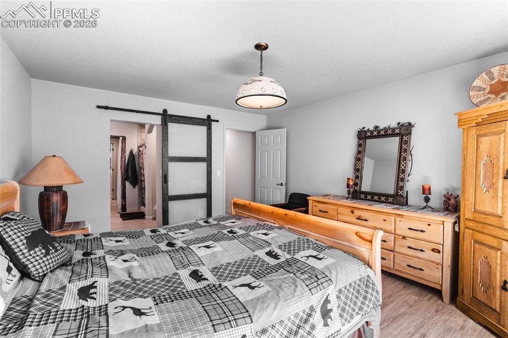 Image 16 of 50: Primary bedroom w/ ensuite